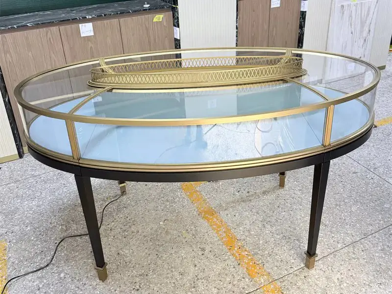 Bespoke Luxury Oval Island Jewelry Showcase designed for modern jewelry store interiors and ambientillumination